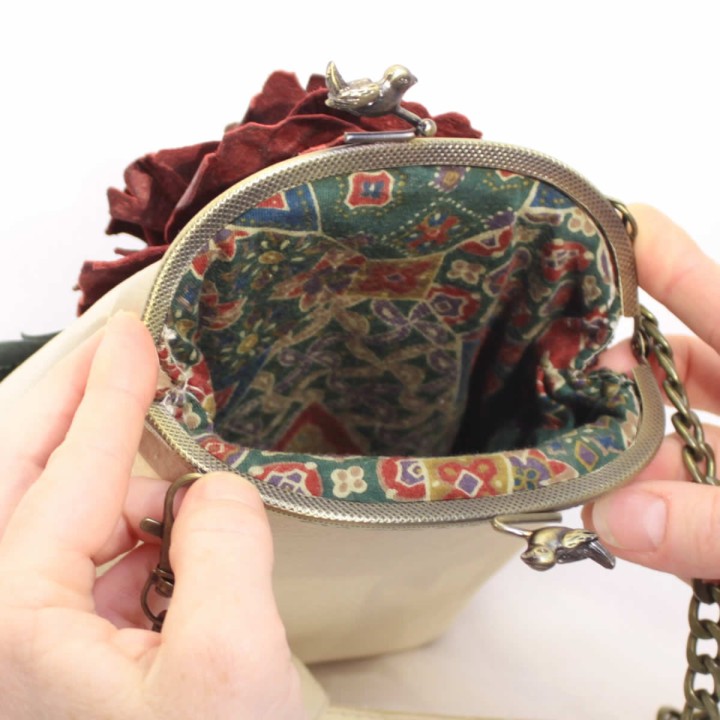 Leather handbag with burgundy flower