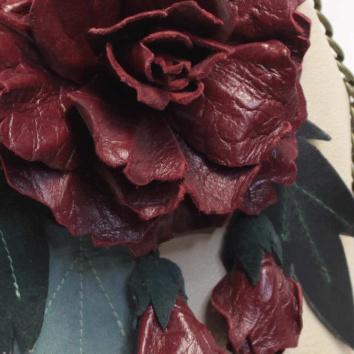 Leather handbag with burgundy flower