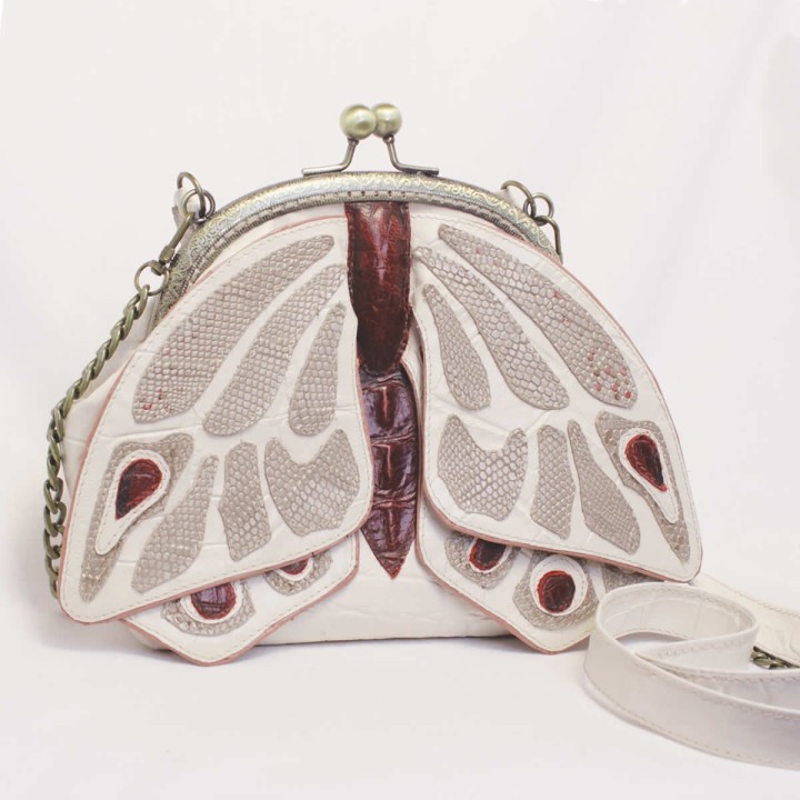 Borsette per telefono in pelle con cerniera e decorazione a farfalla.